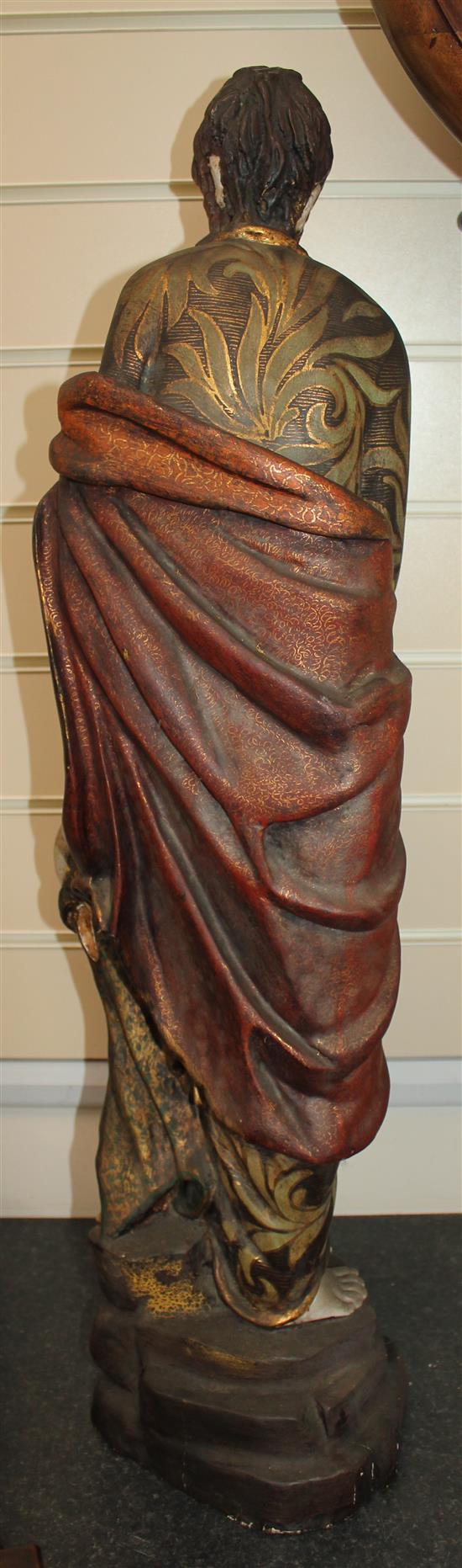 A 20th century carved and polychrome painted figure of a Saint, 31in.